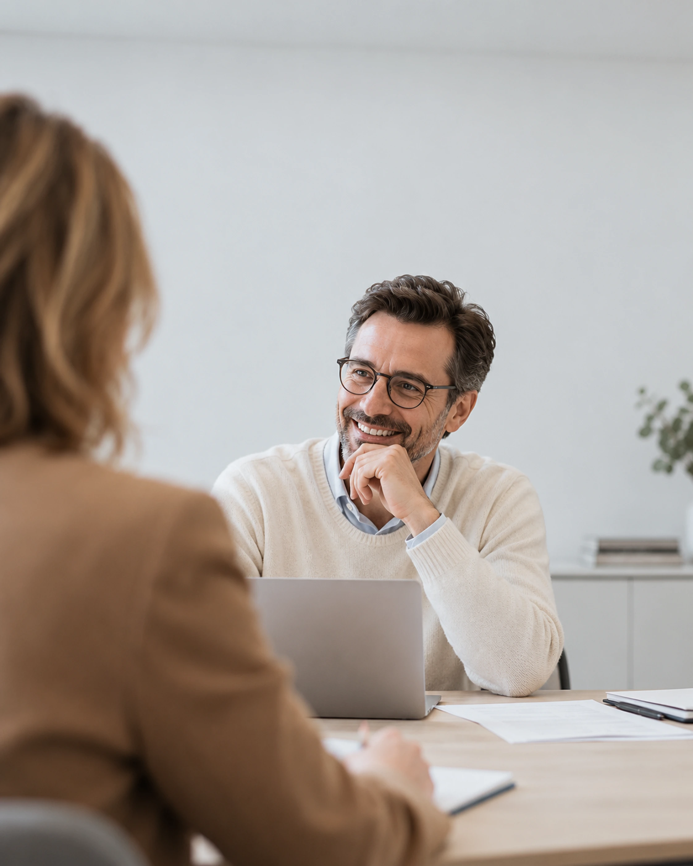 A PwC adviser at a laptop